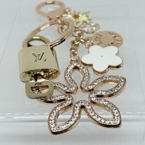 Louis Vuitton Lock & Key #302 w/ a White & Rhinestone Floral Charm Keychain